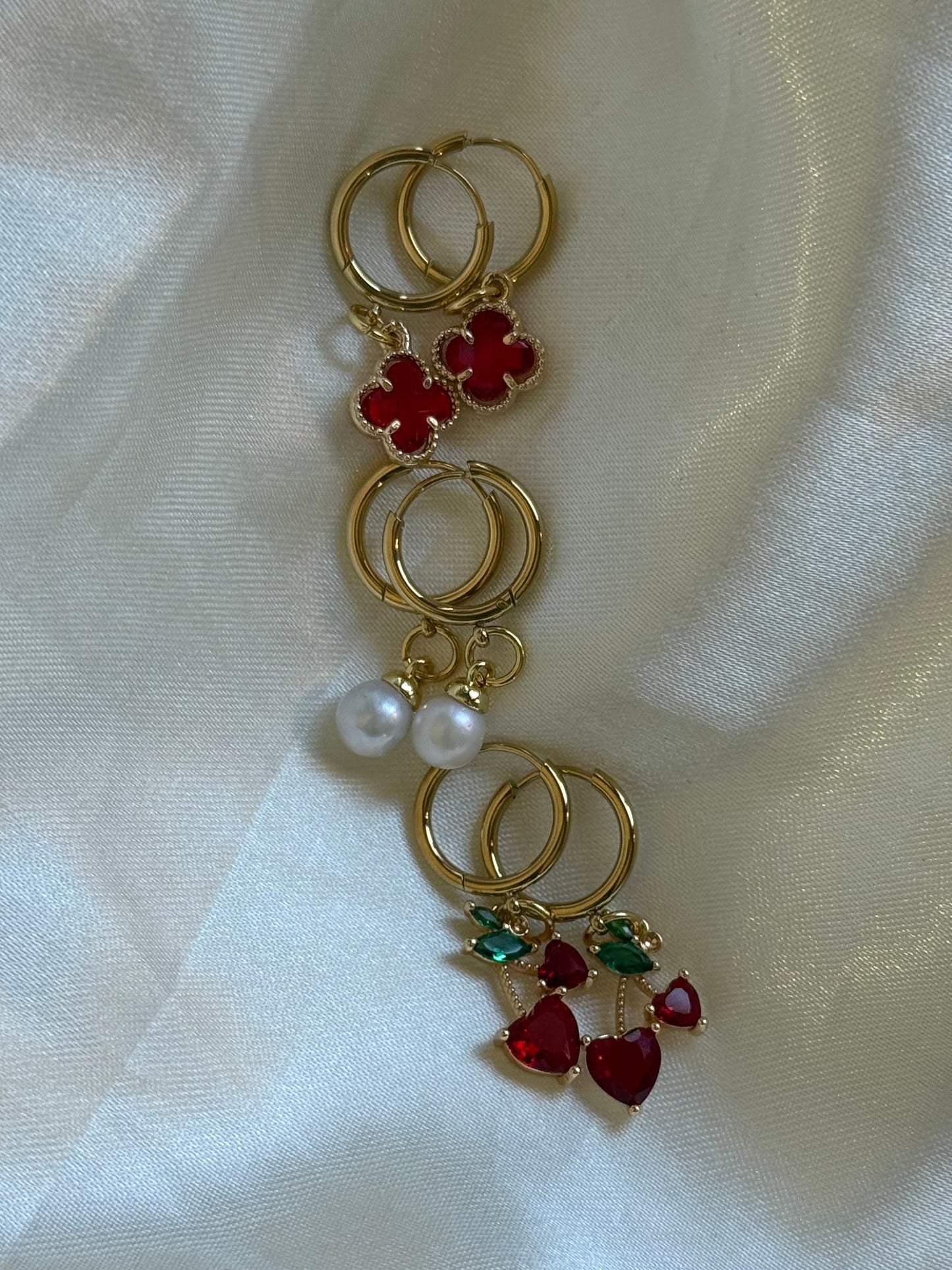 Gold Huggies earrings with red clover, pearl and cherry charms 